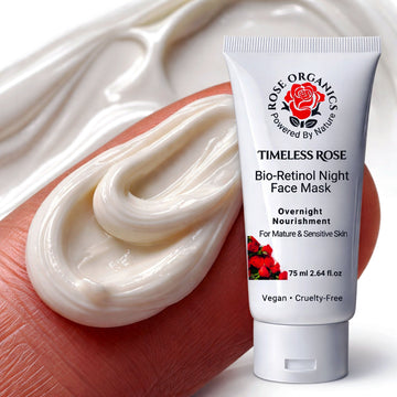 Close-up image of a creamy skincare swatch spread across skin beside a tube of Timeless Rose Bio-Retinol Night Face Mask, highlighting its smooth texture and overnight nourishment benefits.